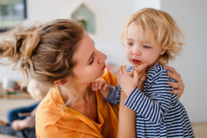 mother comforting toddler 